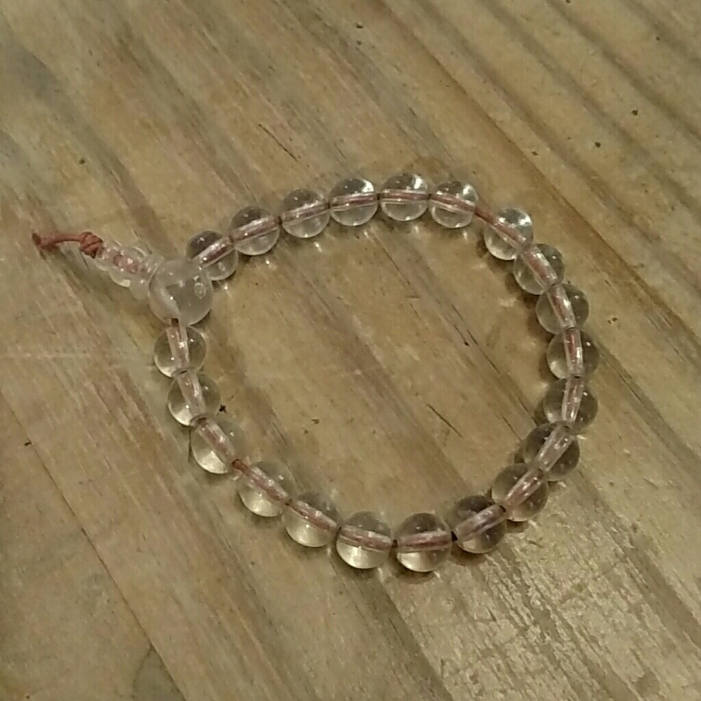 Vintage power beads.  Clear, beaded bracelet on red cord.
